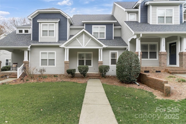 view of front of property featuring a front lawn and a porch