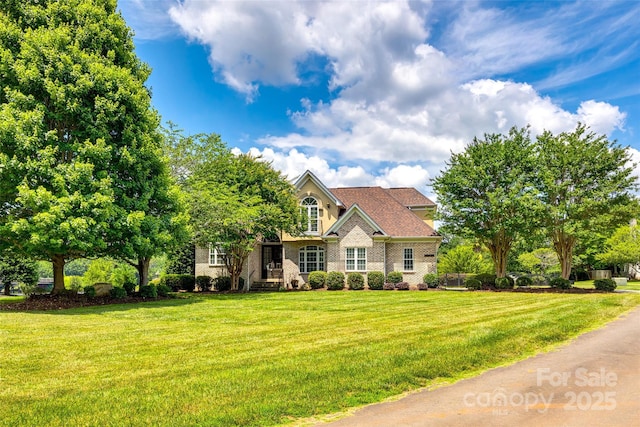 view of front of home with a front lawn