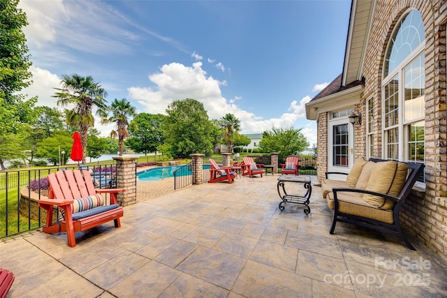 view of patio / terrace with a fenced in pool