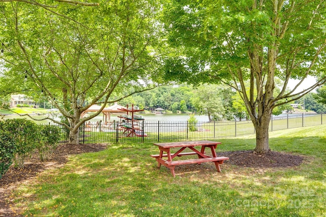 view of yard featuring a playground and fence