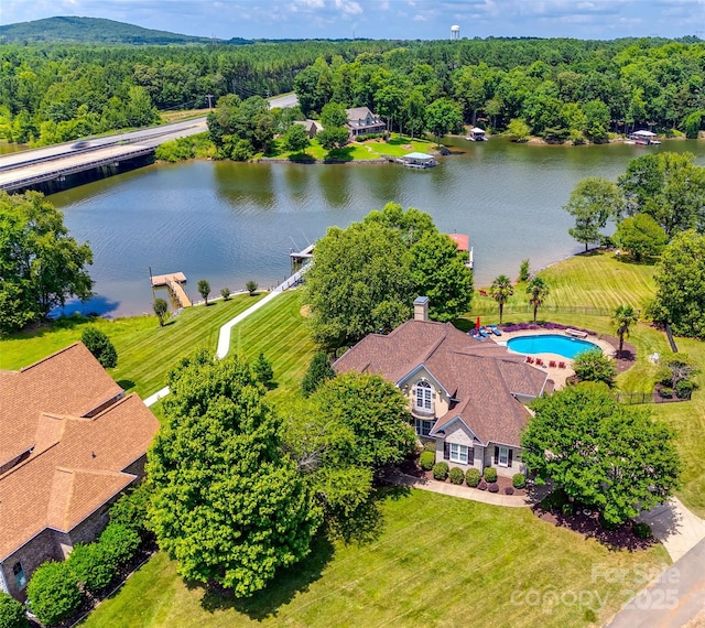 bird's eye view featuring a water view and a view of trees