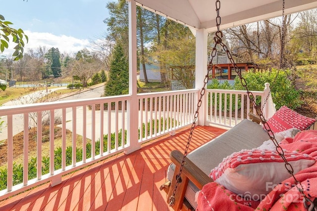 wooden deck featuring covered porch