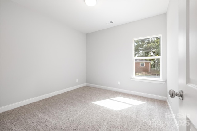 empty room featuring carpet floors