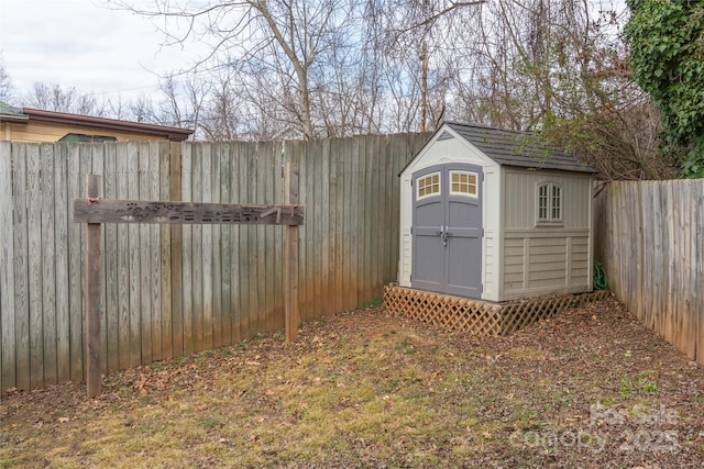 view of shed featuring a fenced backyard