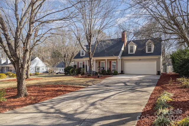 cape cod home with a garage