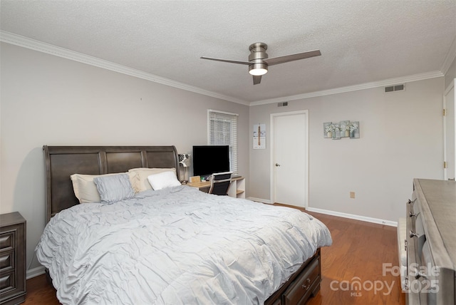 bedroom with ceiling fan, ornamental molding, dark hardwood / wood-style floors, and a textured ceiling