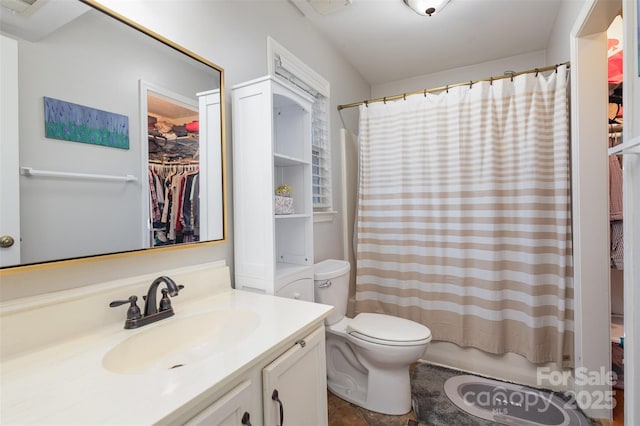 full bathroom with vanity, toilet, and shower / tub combo