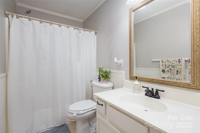 bathroom with vanity, a textured ceiling, ornamental molding, and toilet