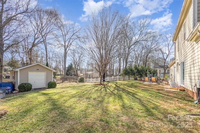 view of yard with an outbuilding and a garage