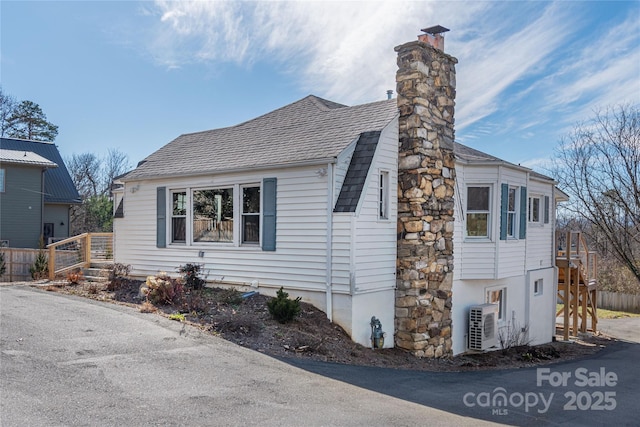 view of home's exterior with ac unit