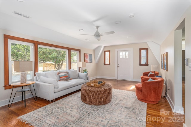 living room with ceiling fan, a wealth of natural light, and hardwood / wood-style floors