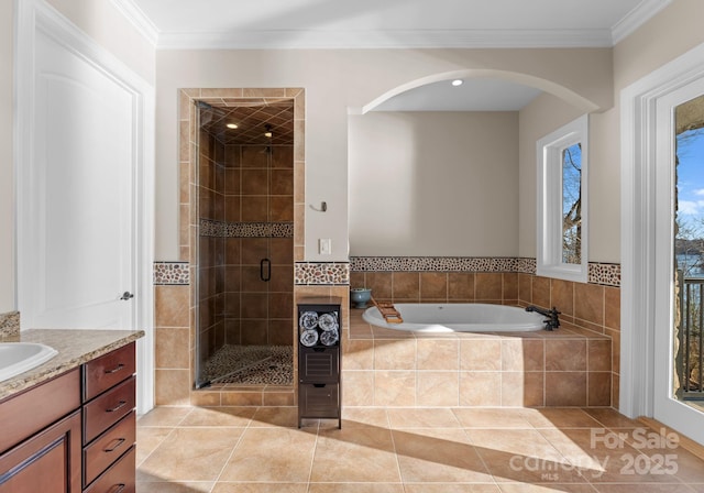 bathroom with independent shower and bath, crown molding, vanity, and tile patterned floors