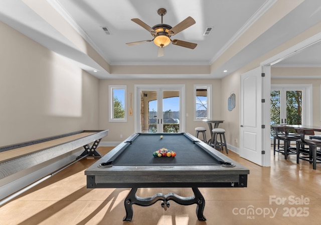 game room featuring plenty of natural light, ornamental molding, and french doors