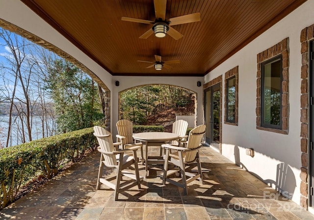 view of patio featuring radiator heating unit and ceiling fan