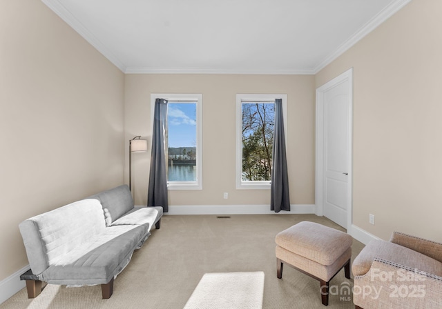 living area with light carpet, ornamental molding, and a water view