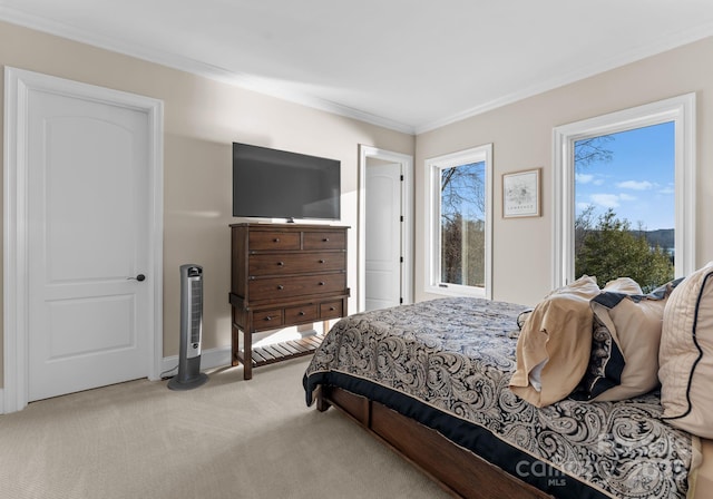 carpeted bedroom featuring baseboards and crown molding