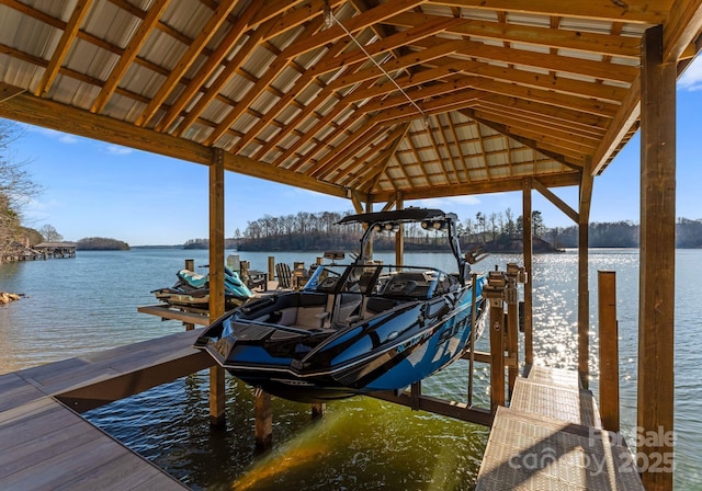 view of dock with a water view and boat lift