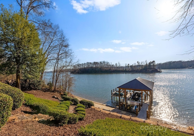 dock area featuring a water view and boat lift