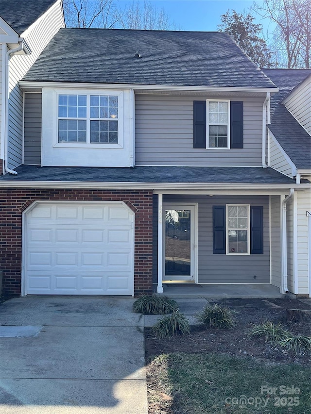 view of front property with a garage and covered porch