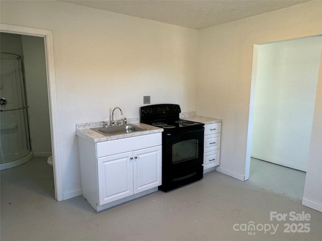 kitchen with white cabinets, sink, and electric range