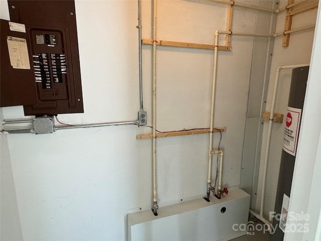 utility room with electric panel and electric water heater