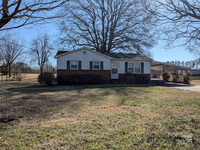 single story home featuring a carport and a front yard