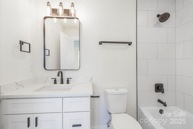 full bathroom featuring tiled shower / bath combo, vanity, and toilet