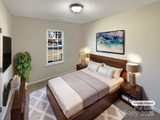 bedroom featuring a textured ceiling