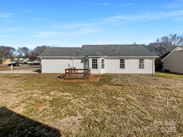 back of house with a yard