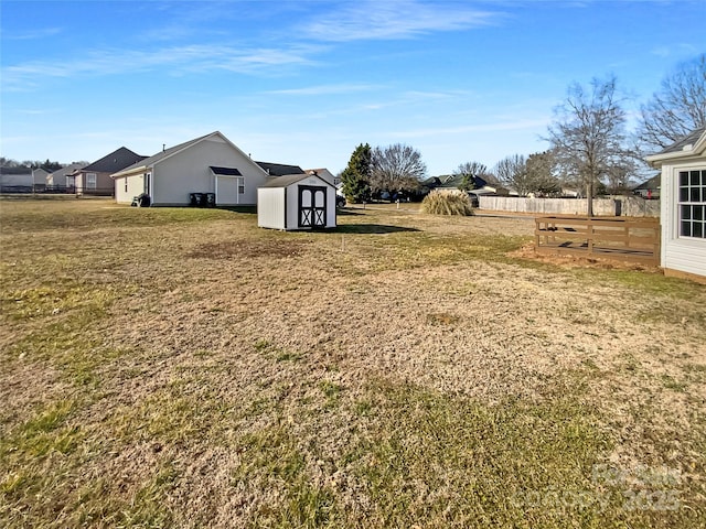 view of yard with a storage unit