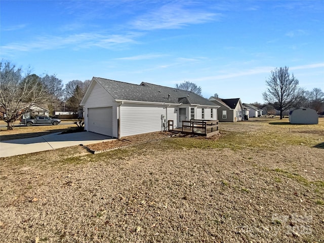 exterior space featuring a yard and a garage