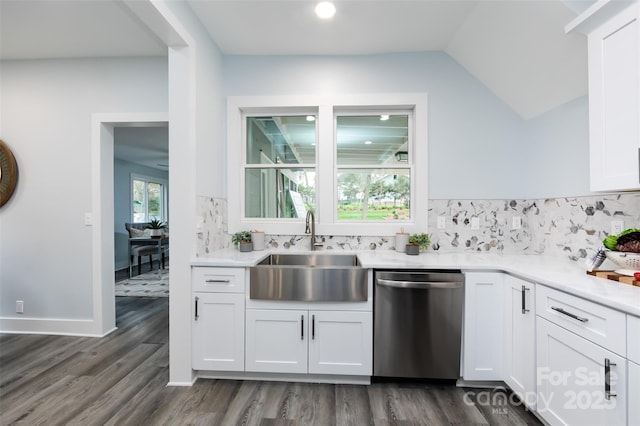 kitchen with dishwasher, sink, white cabinets, and backsplash