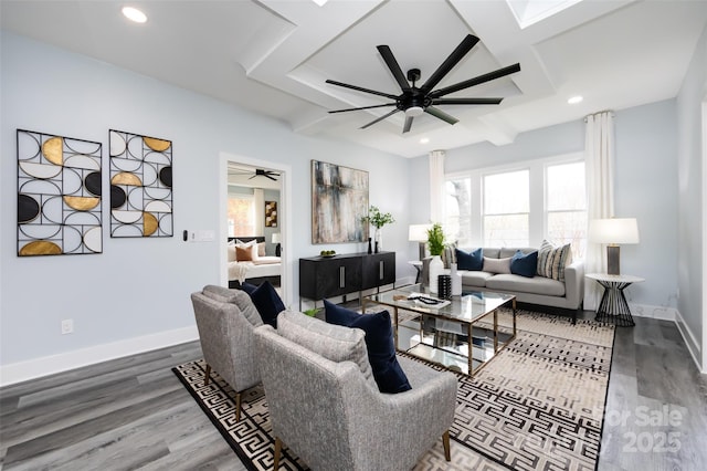 living room featuring wood-type flooring, beamed ceiling, and ceiling fan