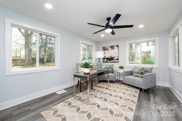 office space featuring dark wood-type flooring and ceiling fan