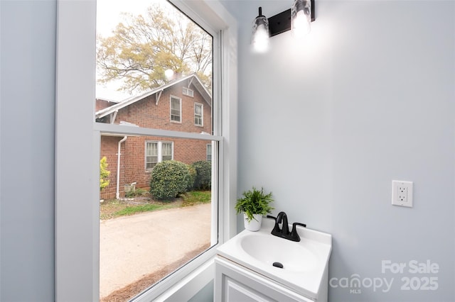 bathroom with sink and a wealth of natural light