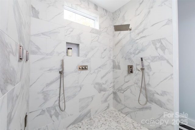 bathroom featuring tiled shower