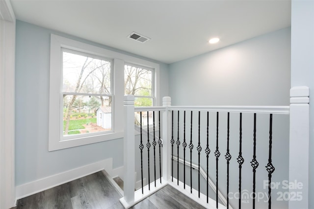 hall with dark hardwood / wood-style flooring