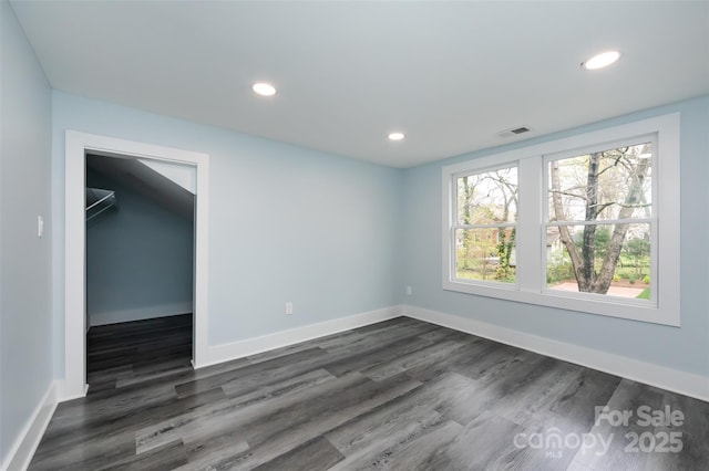 unfurnished room with dark hardwood / wood-style floors