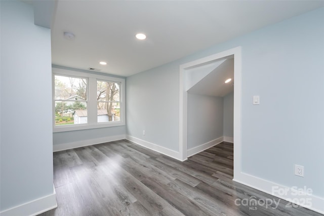 empty room featuring wood-type flooring