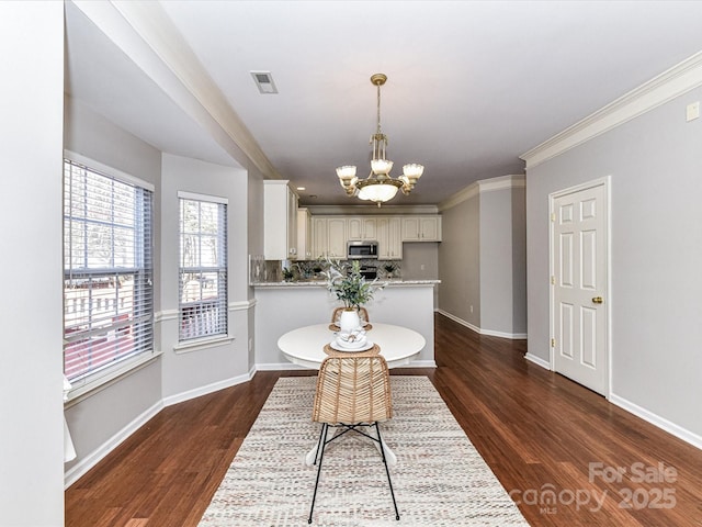 dining space with a chandelier, dark wood-style flooring, visible vents, and baseboards