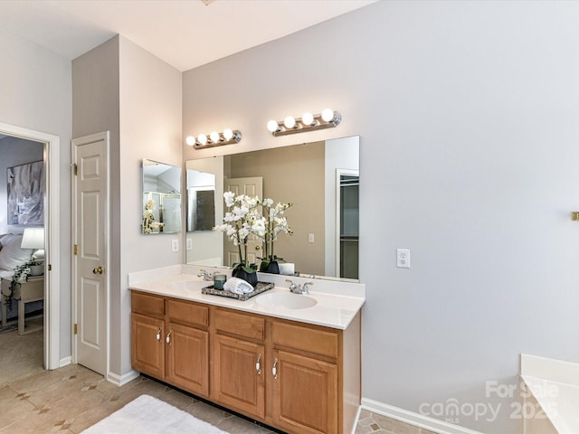 bathroom with a closet, a sink, and double vanity