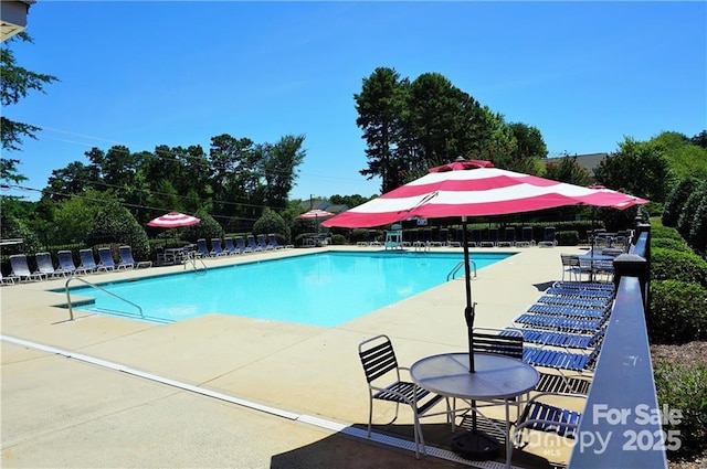 community pool with a patio