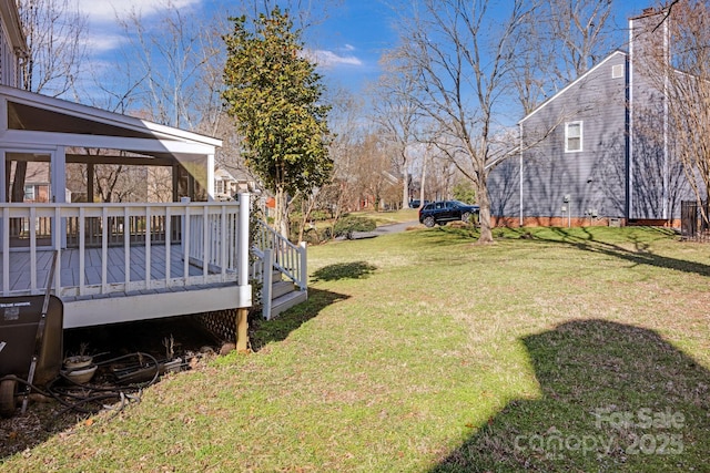 view of yard with a wooden deck