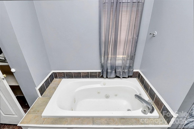 bathroom featuring tiled bath