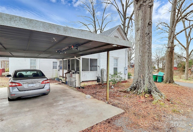 exterior space featuring a carport and a sunroom