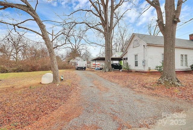 exterior space with a carport