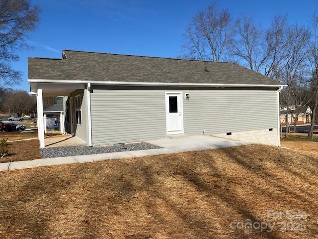 rear view of property with a patio area and a lawn