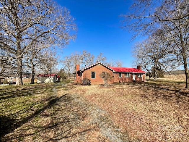 view of home's exterior with a lawn