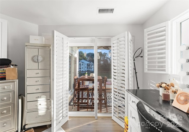 interior space with visible vents and light wood finished floors