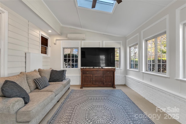 sunroom / solarium featuring lofted ceiling with skylight and an AC wall unit